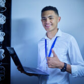 Man, thumbs up and server room on computer in cybersecurity, IT cables and hardware or data safety .