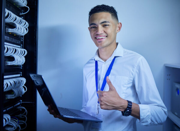 Man, thumbs up and server room on computer in cybersecurity, IT cables and hardware or data safety .