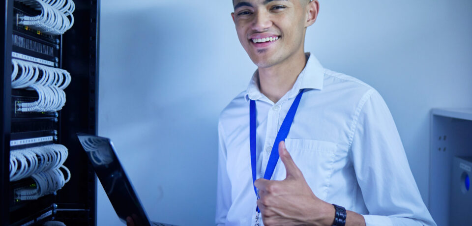 Man, thumbs up and server room on computer in cybersecurity, IT cables and hardware or data safety .